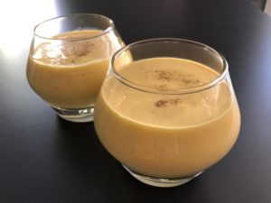 Cooling refreshing naturally sweetened mango lassi to have as a snack